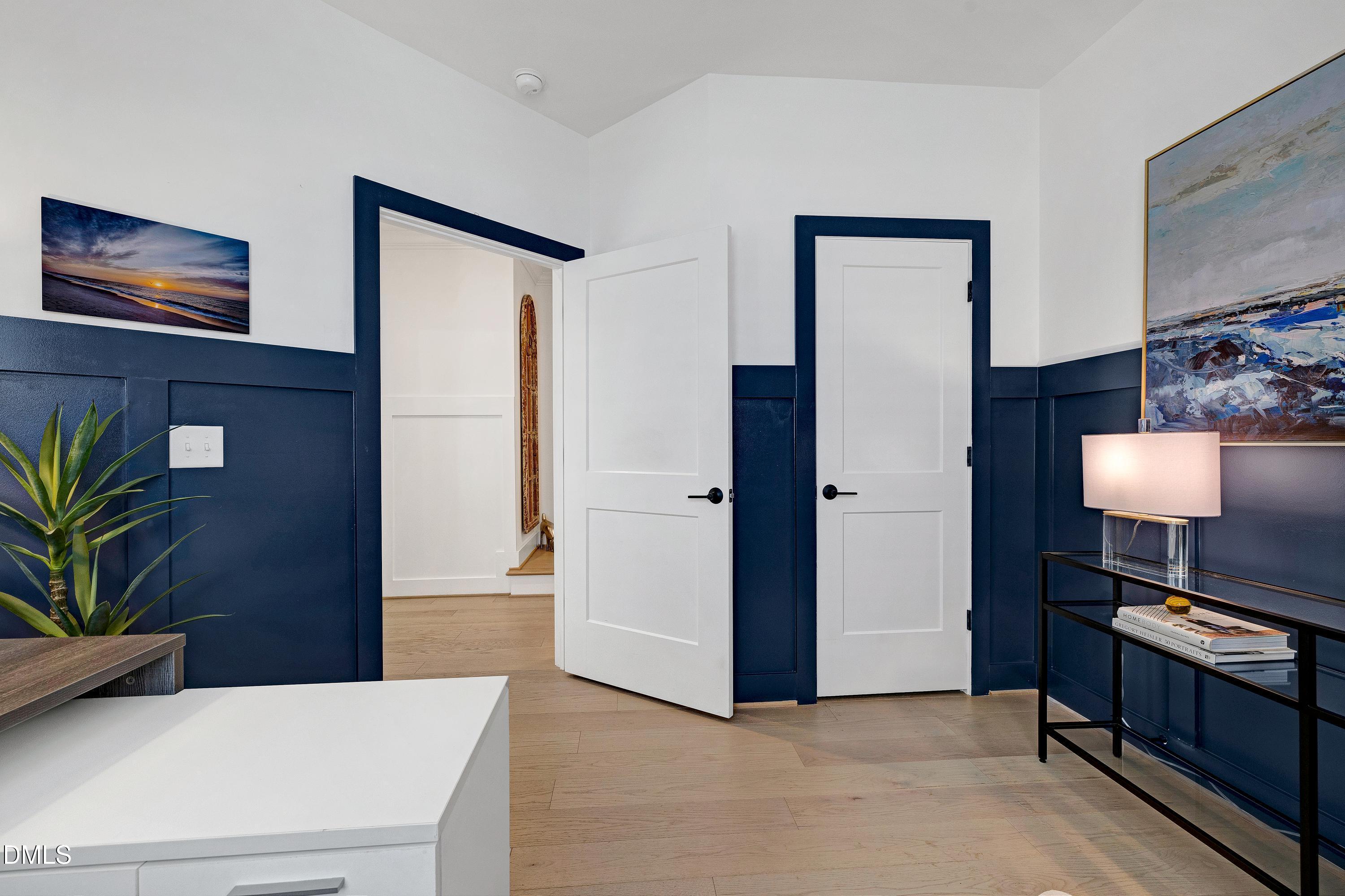 400 Bryan Pointe Drive, Unit 104 Raleigh, NC 27608 - Photo 13 of 66 a living room with furniture and a lamp