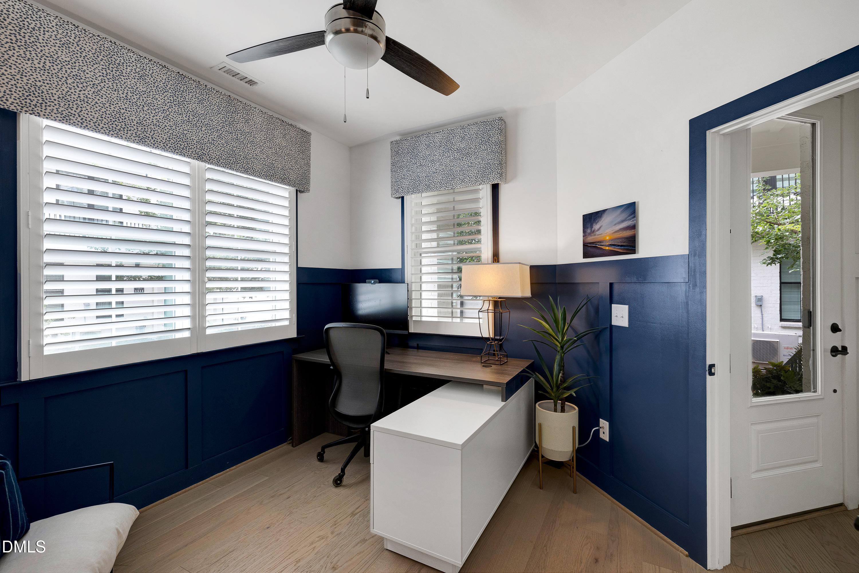 400 Bryan Pointe Drive, Unit 104 Raleigh, NC 27608 - Photo 14 of 66 a view of a workspace with furniture and a window
