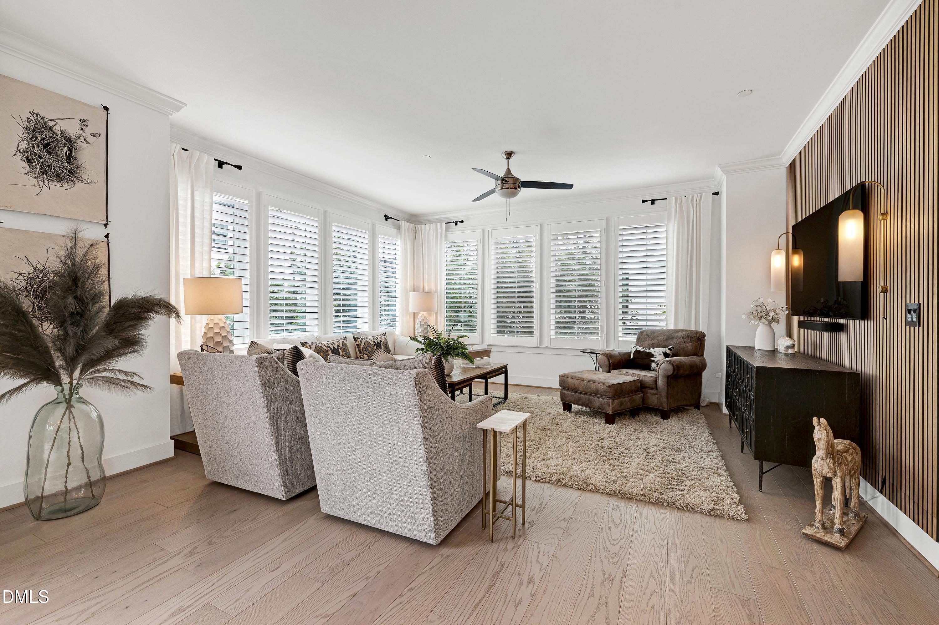 400 Bryan Pointe Drive, Unit 104 Raleigh, NC 27608 - Photo 24 of 66 a living room with furniture fireplace and flat screen tv