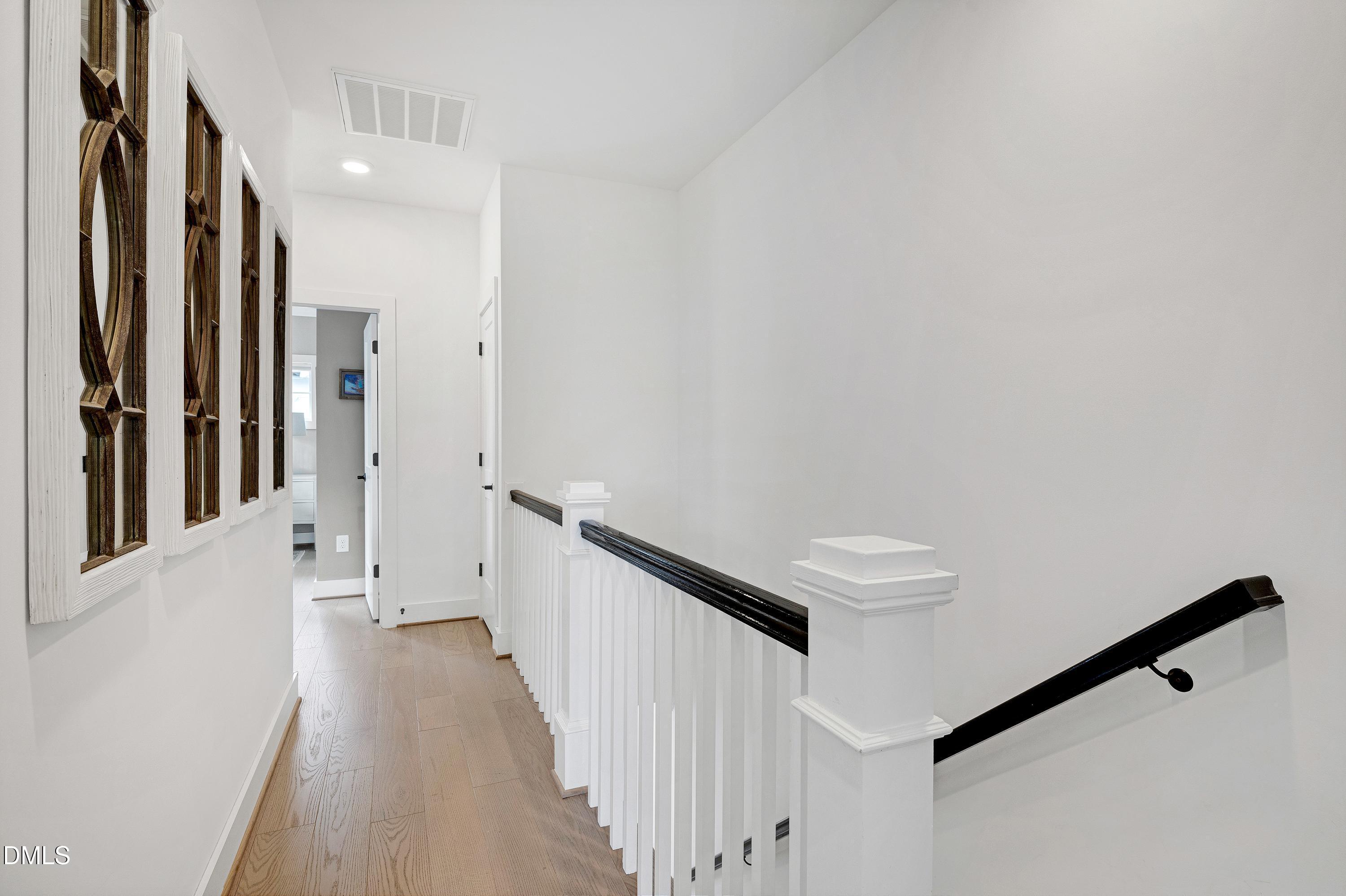 400 Bryan Pointe Drive, Unit 104 Raleigh, NC 27608 - Photo 31 of 66 a view of a hallway with staircase