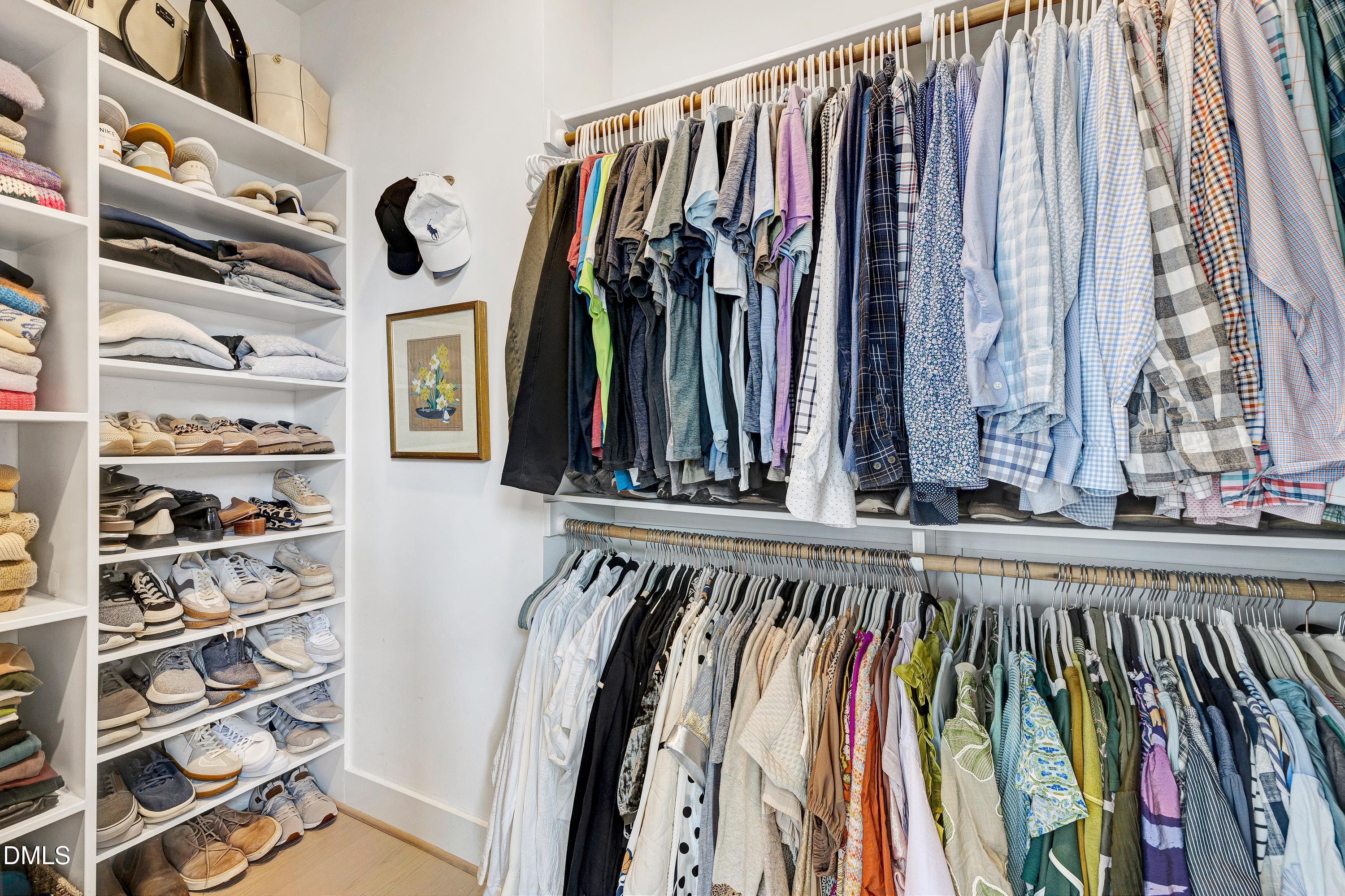 400 Bryan Pointe Drive, Unit 104 Raleigh, NC 27608 - Photo 35 of 66 a view of walk in closet with clothes and shoes