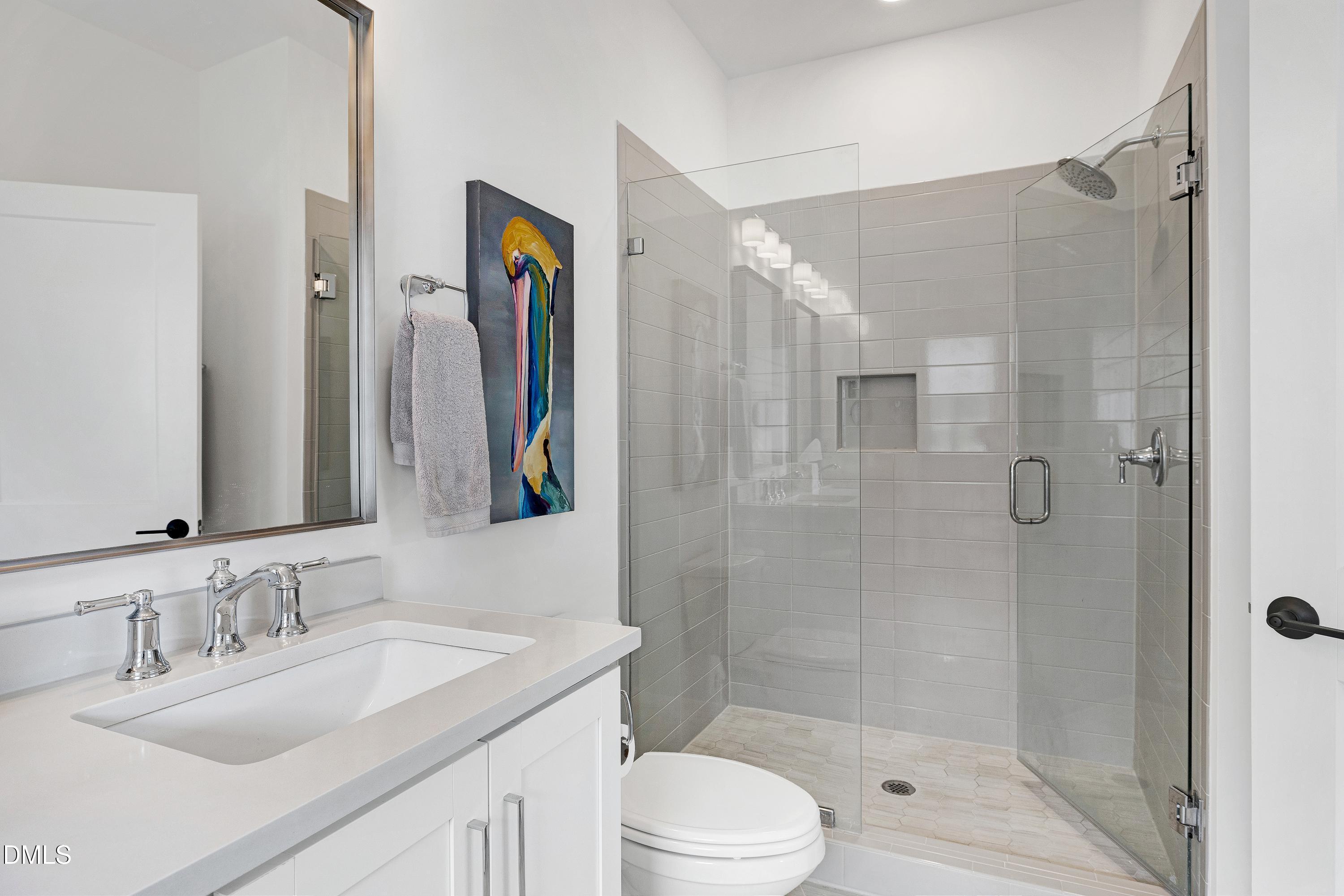 400 Bryan Pointe Drive, Unit 104 Raleigh, NC 27608 - Photo 38 of 66 a bathroom with a granite countertop sink toilet and shower