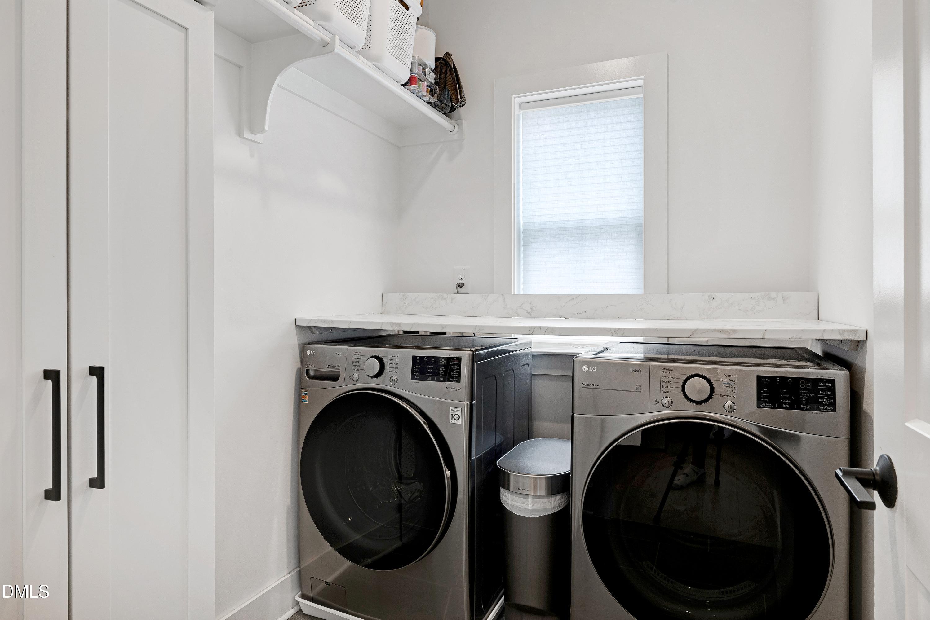 400 Bryan Pointe Drive, Unit 104 Raleigh, NC 27608 - Photo 45 of 66 a utility room with dryer and washer