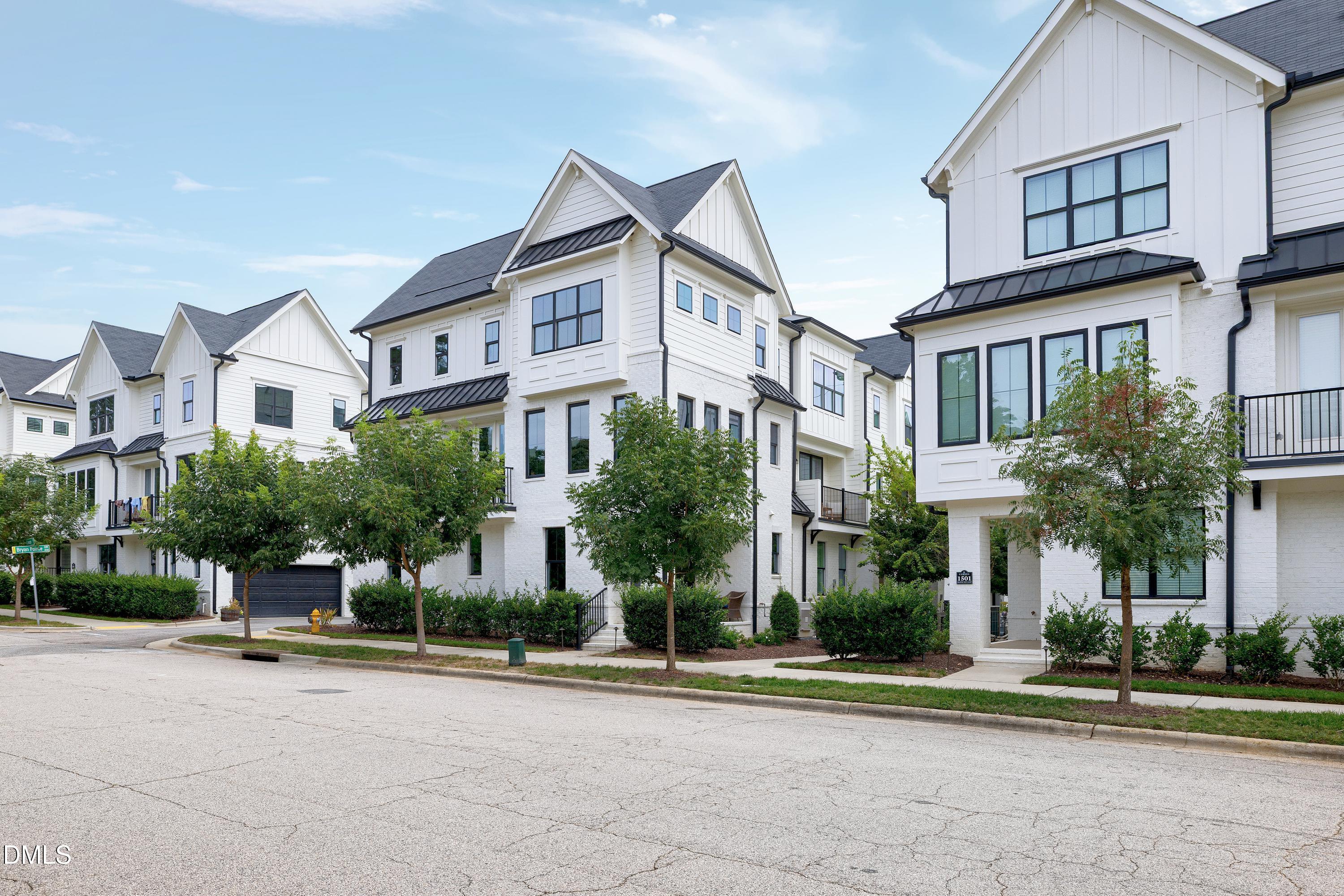 400 Bryan Pointe Drive, Unit 104 Raleigh, NC 27608 - Photo 50 of 66 front view of a house with a yard