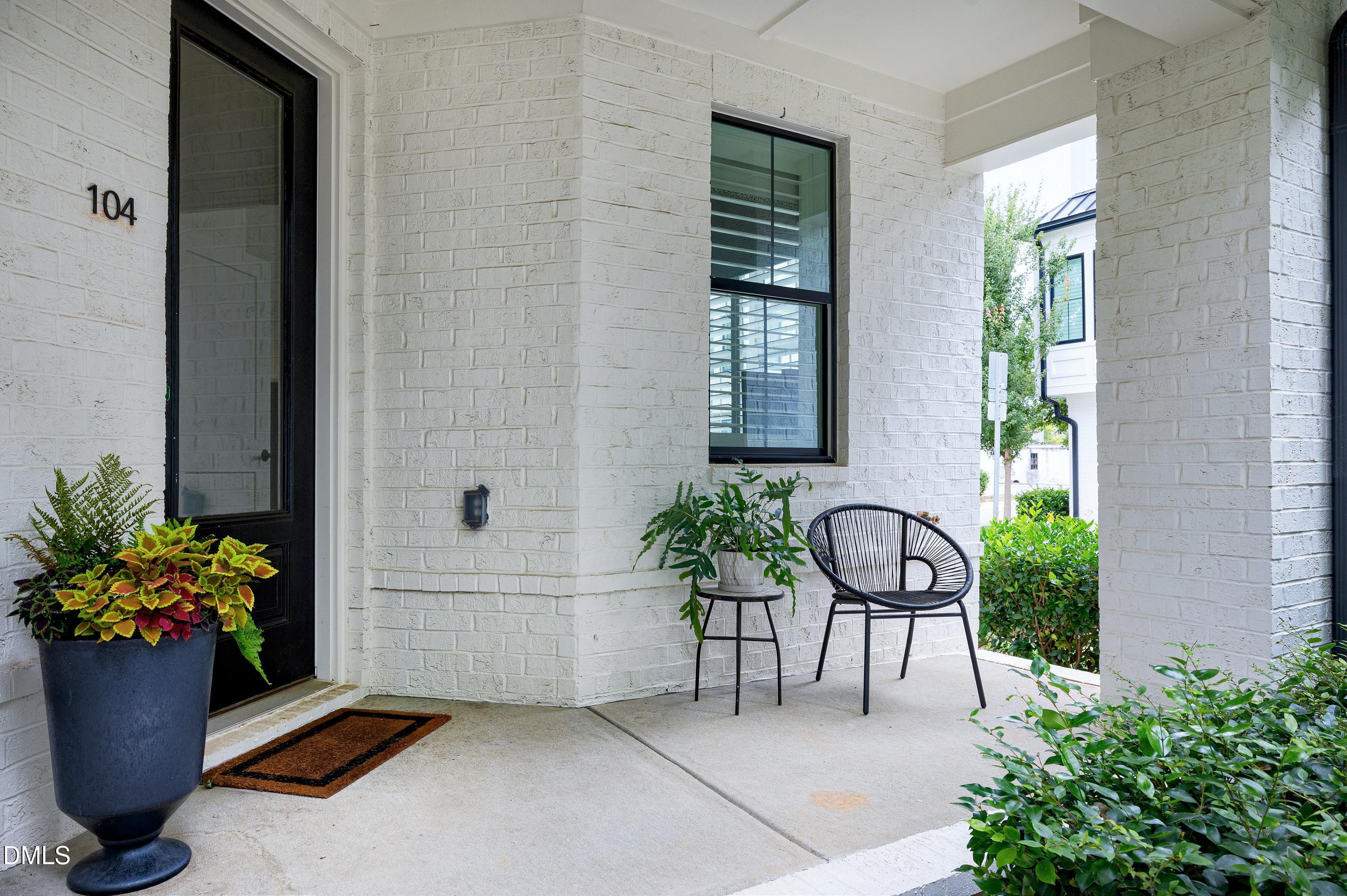400 Bryan Pointe Drive, Unit 104 Raleigh, NC 27608 - Photo 52 of 66 a house view with a potted plant