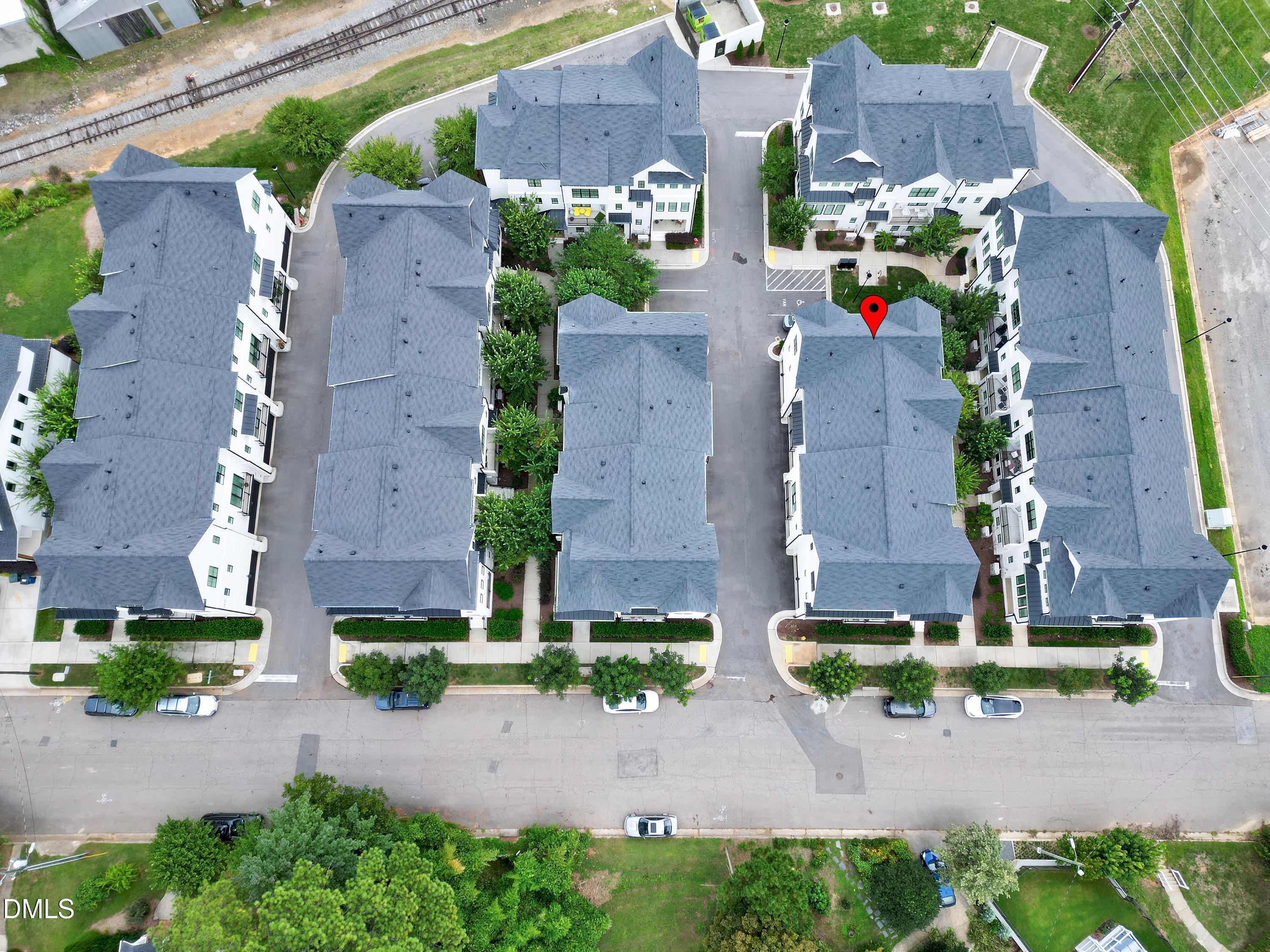 400 Bryan Pointe Drive, Unit 104 Raleigh, NC 27608 - Photo 60 of 66 an aerial view of a house with a garden and yard