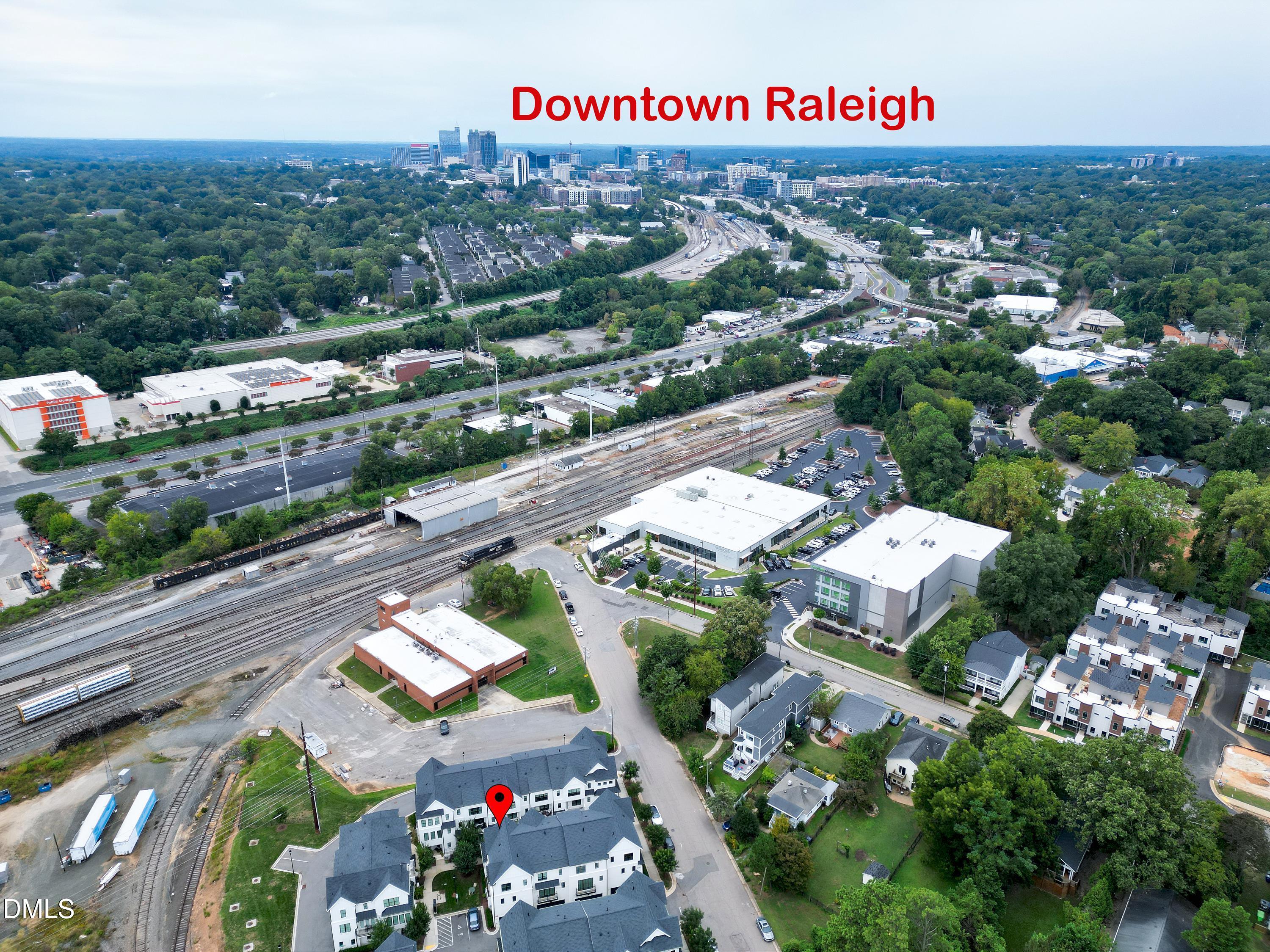 400 Bryan Pointe Drive, Unit 104 Raleigh, NC 27608 - Photo 63 of 66 an aerial view of residential houses with outdoor space