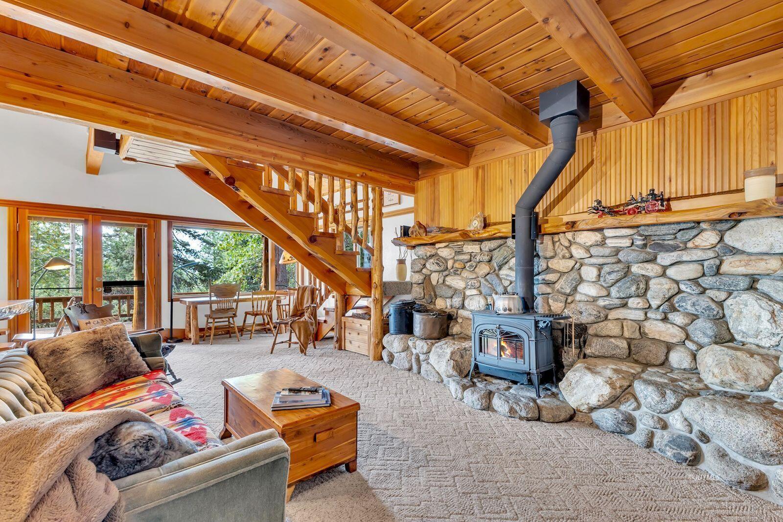 52980 Overlook Drive Idyllwild, CA 92549 - Photo 13 of 60 a living room with furniture and a chandelier
