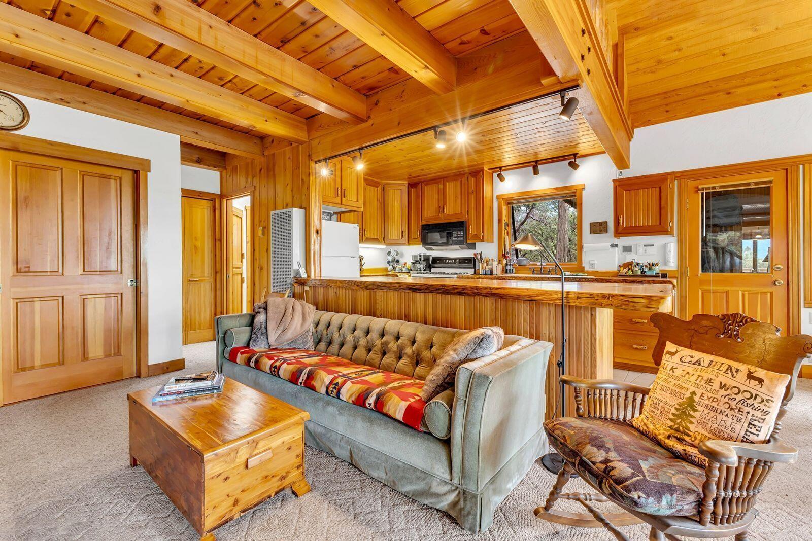 52980 Overlook Drive Idyllwild, CA 92549 - Photo 15 of 60 a view of a living room with furniture and a large window