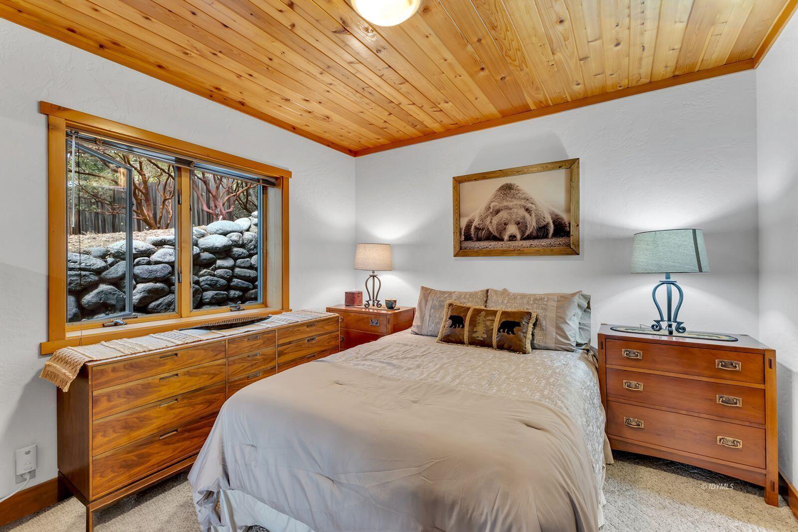 52980 Overlook Drive Idyllwild, CA 92549 - Photo 22 of 60 a bedroom with a bed and a painting on the wall