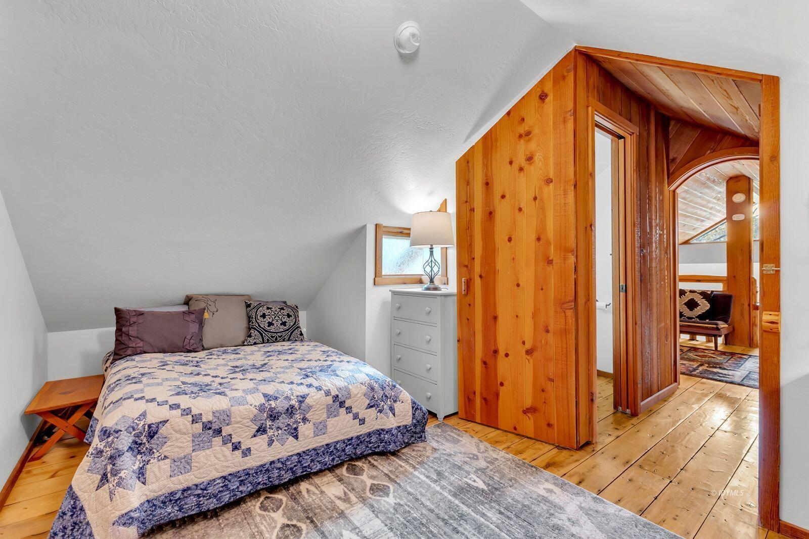 52980 Overlook Drive Idyllwild, CA 92549 - Photo 35 of 60 a bedroom with a bed and a mirror