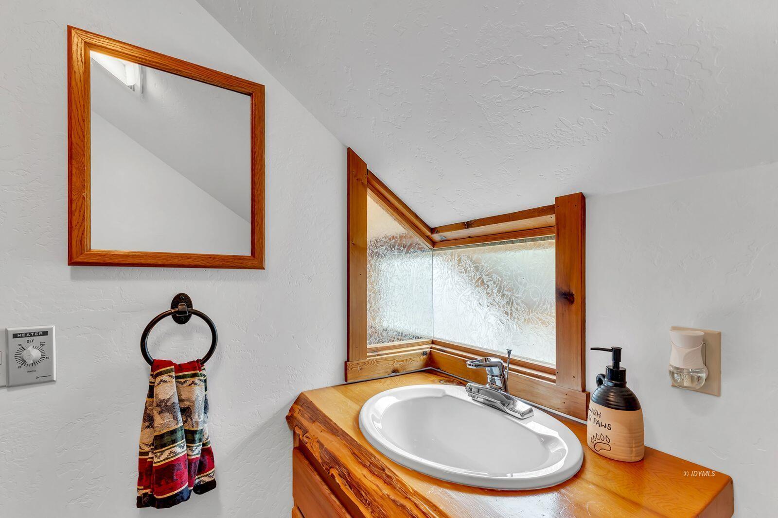 52980 Overlook Drive Idyllwild, CA 92549 - Photo 36 of 60 a bathroom with a sink mirror and vanity
