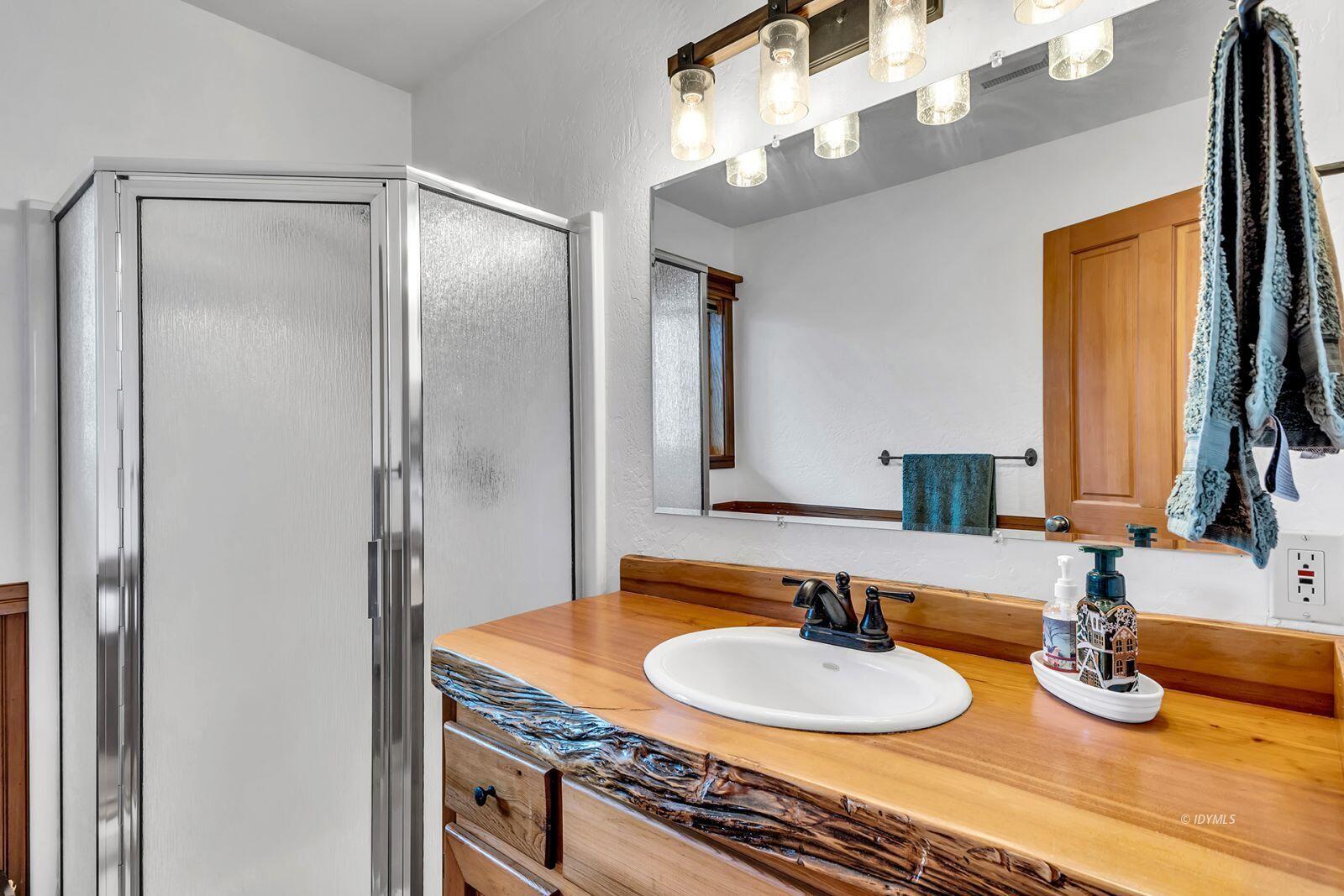 52980 Overlook Drive Idyllwild, CA 92549 - Photo 48 of 60 a bathroom with a granite countertop sink and a mirror
