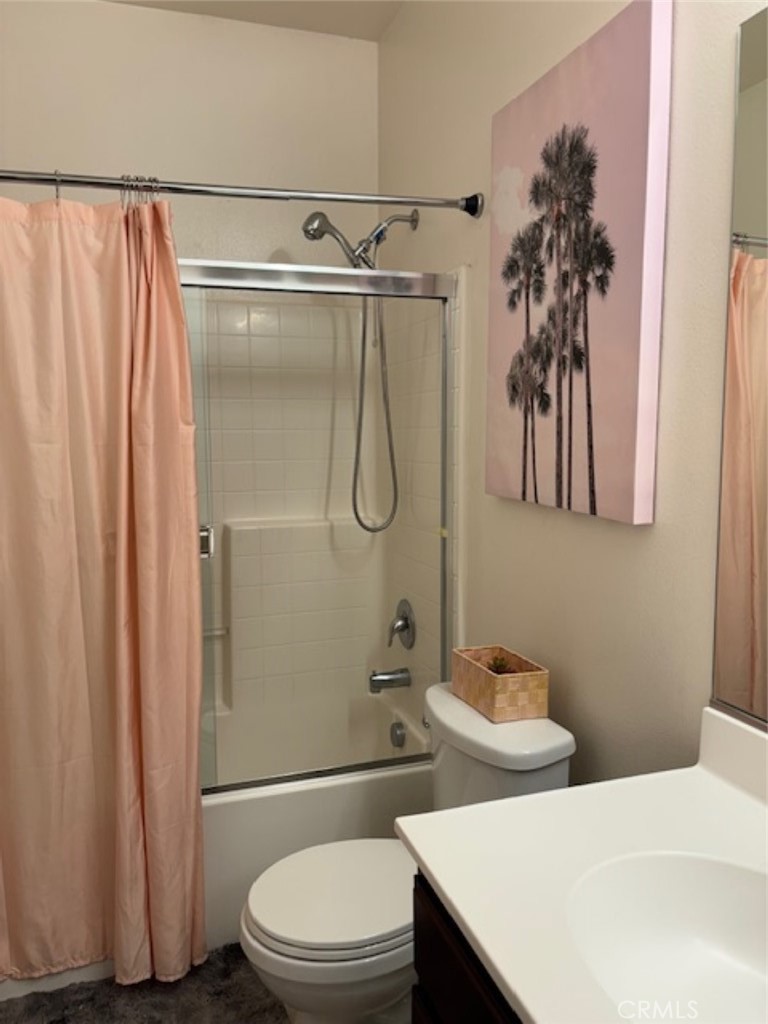 2090 Trinket Circle San Jacinto, CA 92582 - Photo 12 of 22 a bathroom with a shower toilet and sink