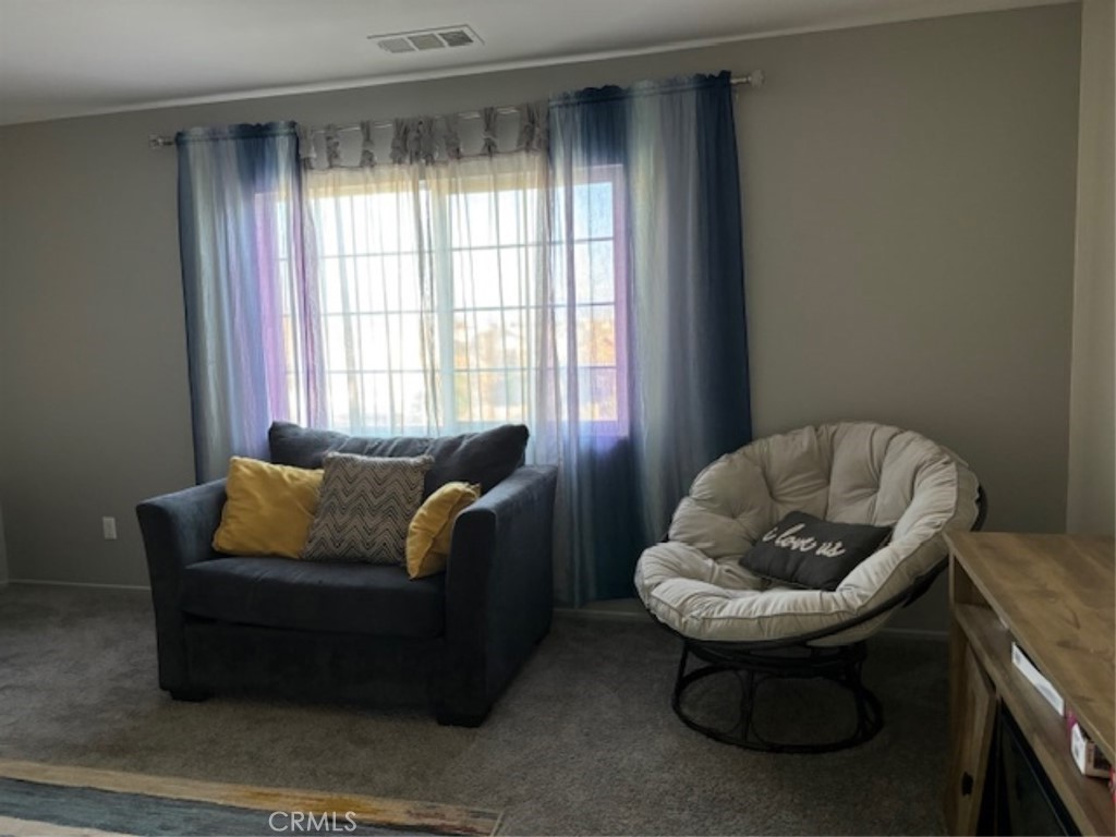 2090 Trinket Circle San Jacinto, CA 92582 - Photo 16 of 22 a living room with furniture and a window