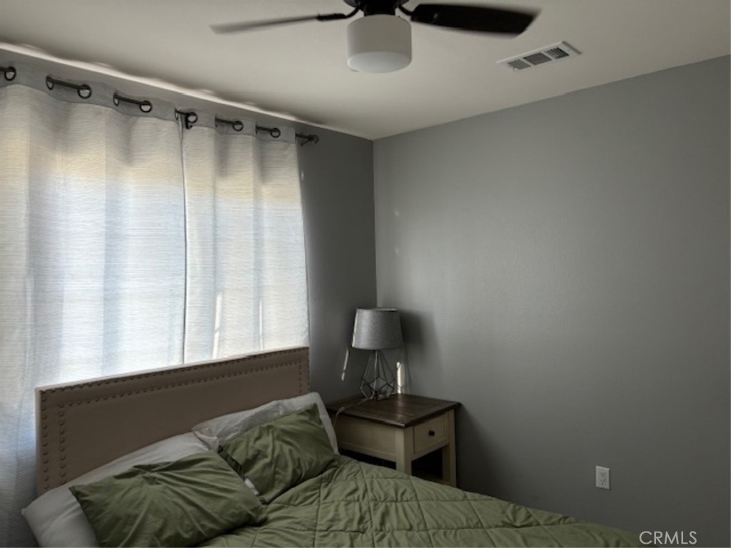 2090 Trinket Circle San Jacinto, CA 92582 - Photo 20 of 22 a living room with furniture and a window