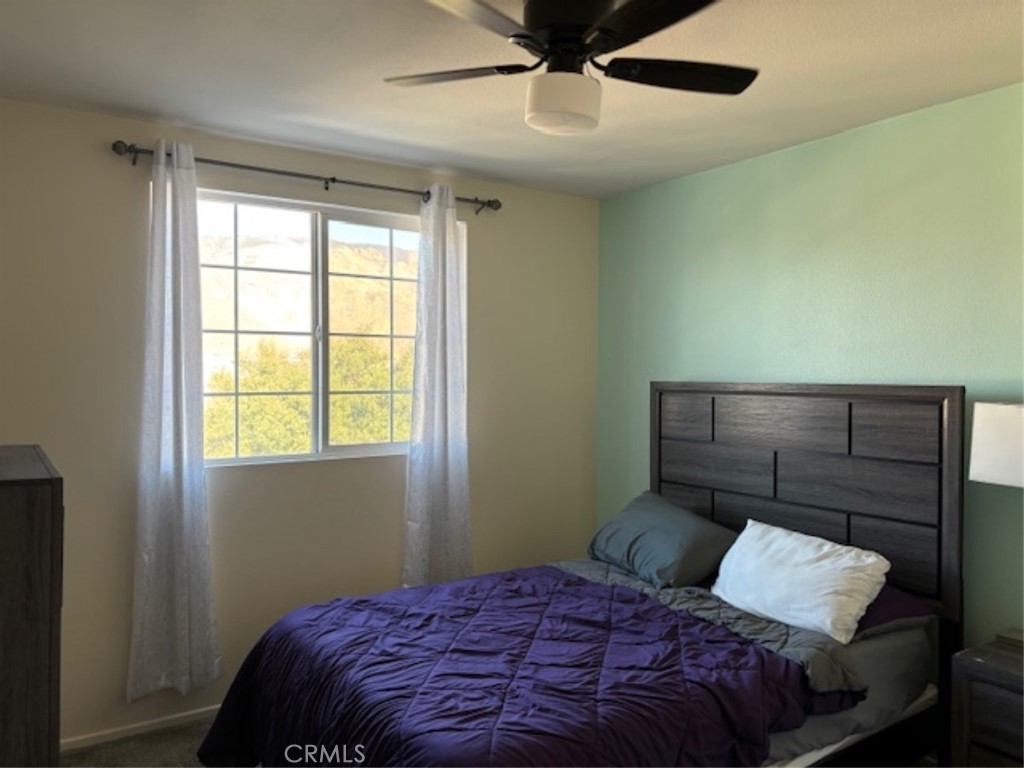 2090 Trinket Circle San Jacinto, CA 92582 - Photo 21 of 22 a bedroom with a bed and a window