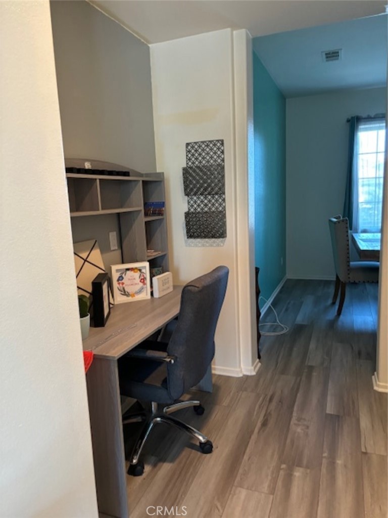 2090 Trinket Circle San Jacinto, CA 92582 - Photo 3 of 22 a view of workspace with wooden floor lounge chair