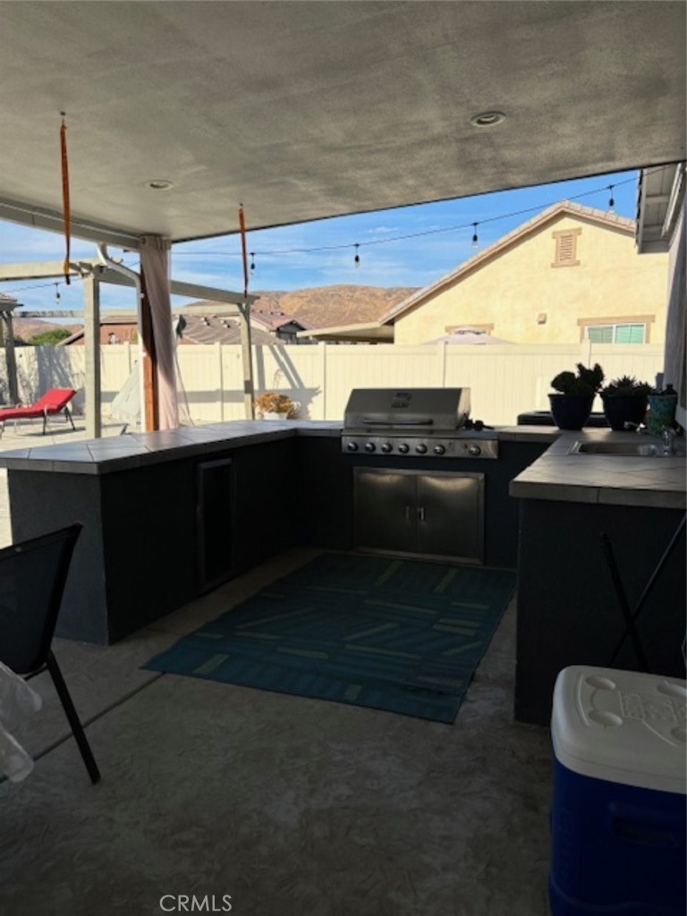 2090 Trinket Circle San Jacinto, CA 92582 - Photo 6 of 22 a kitchen with stainless steel appliances a sink and a microwave