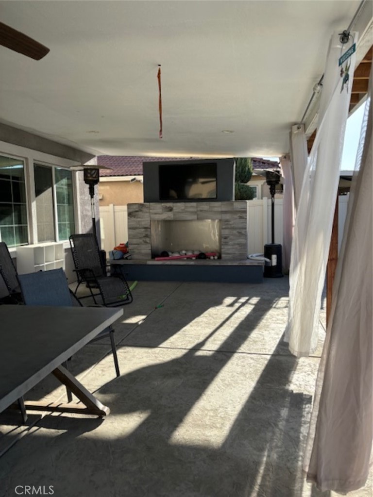 2090 Trinket Circle San Jacinto, CA 92582 - Photo 10 of 22 a living room with a couch a rug and a window