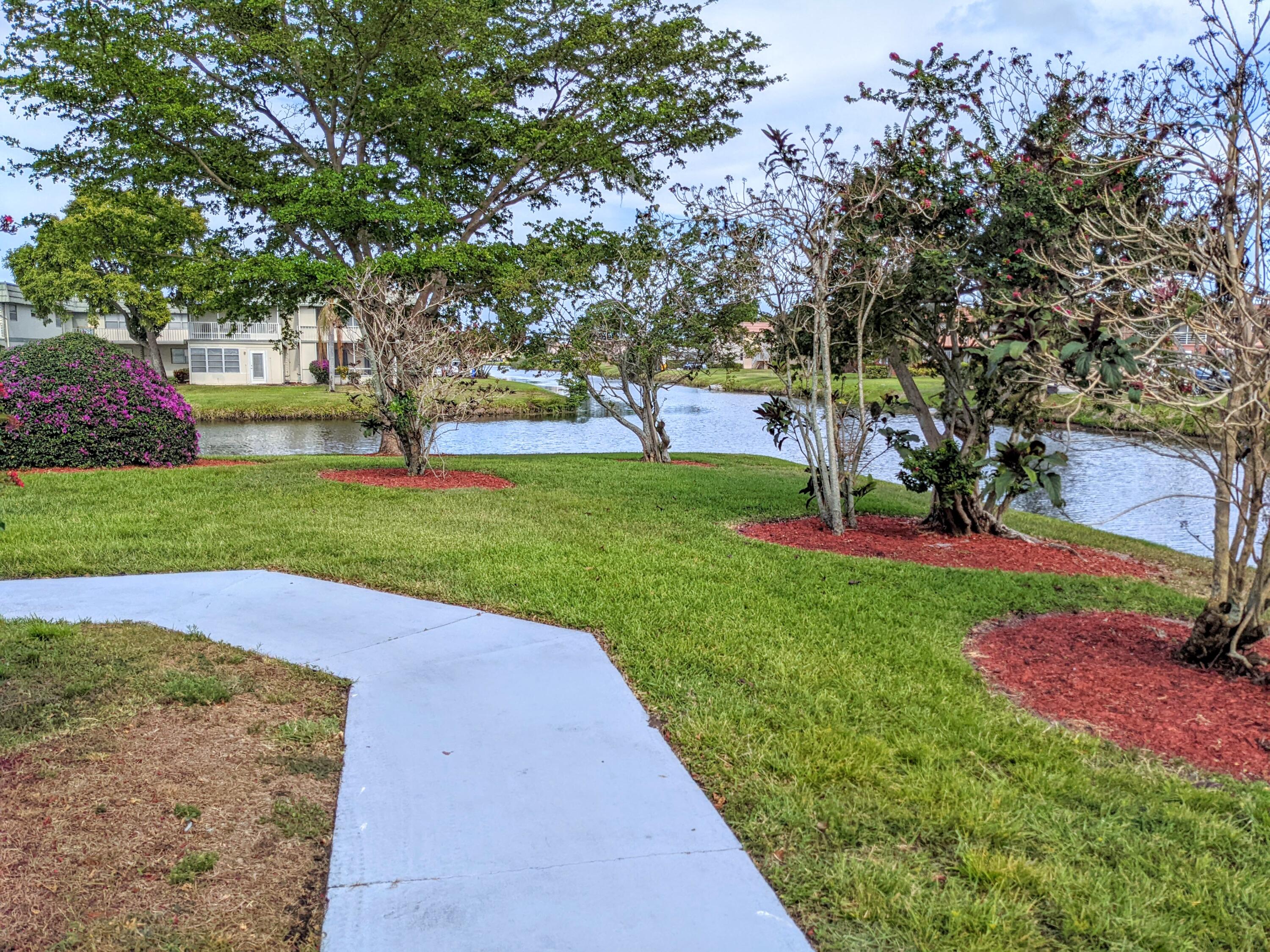 405 Monaco Way, Unit 405 Delray Beach, FL 33446 - Photo 26 of 30 Sidewalk to unit