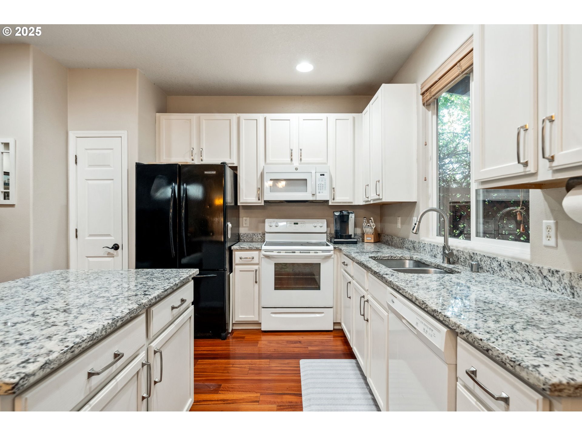 3367 Northwest 31st Circle Camas, WA 98607 - Photo 13 of 30 a kitchen with stainless steel appliances granite countertop a stove a sink and a refrigerator
