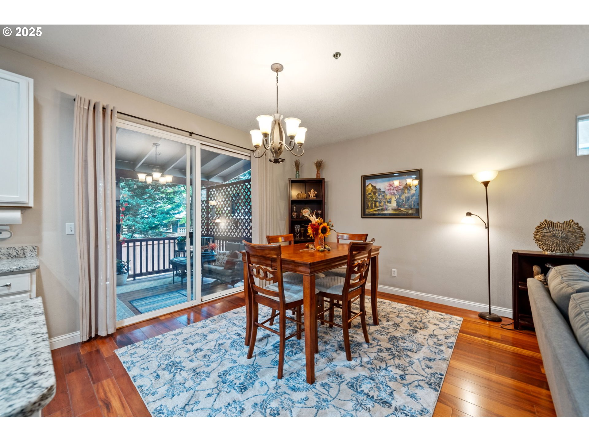 3367 Northwest 31st Circle Camas, WA 98607 - Photo 14 of 30 a dining room with furniture a chandelier and wooden floor