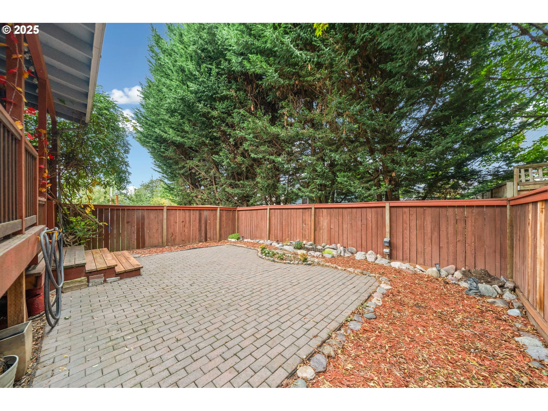 3367 Northwest 31st Circle Camas, WA 98607 - Photo 29 of 30 a backyard of a house with table and chairs
