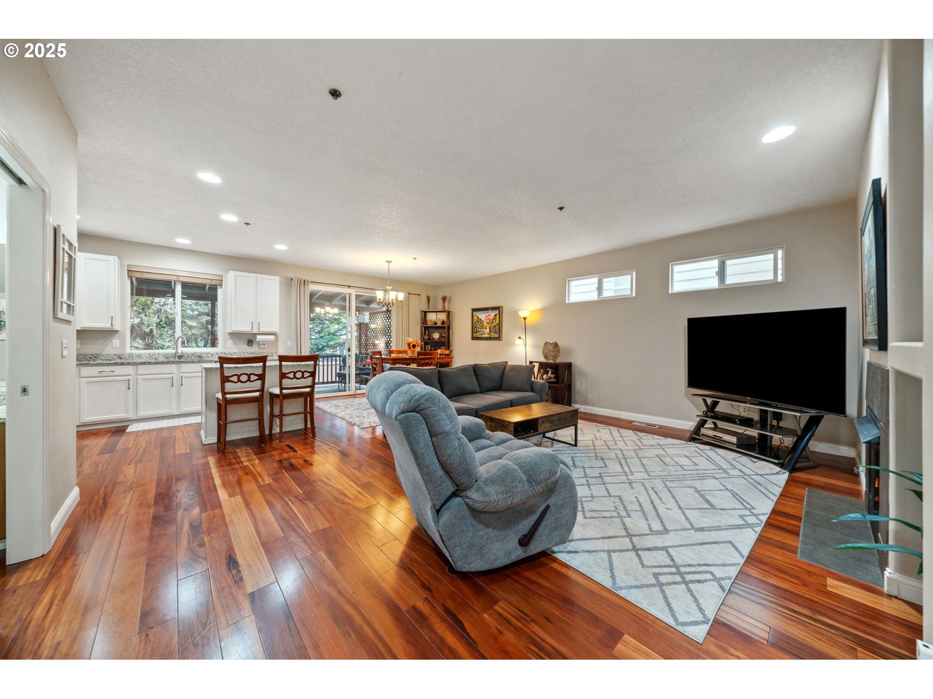 3367 Northwest 31st Circle Camas, WA 98607 - Photo 6 of 30 a living room with furniture and a flat screen tv