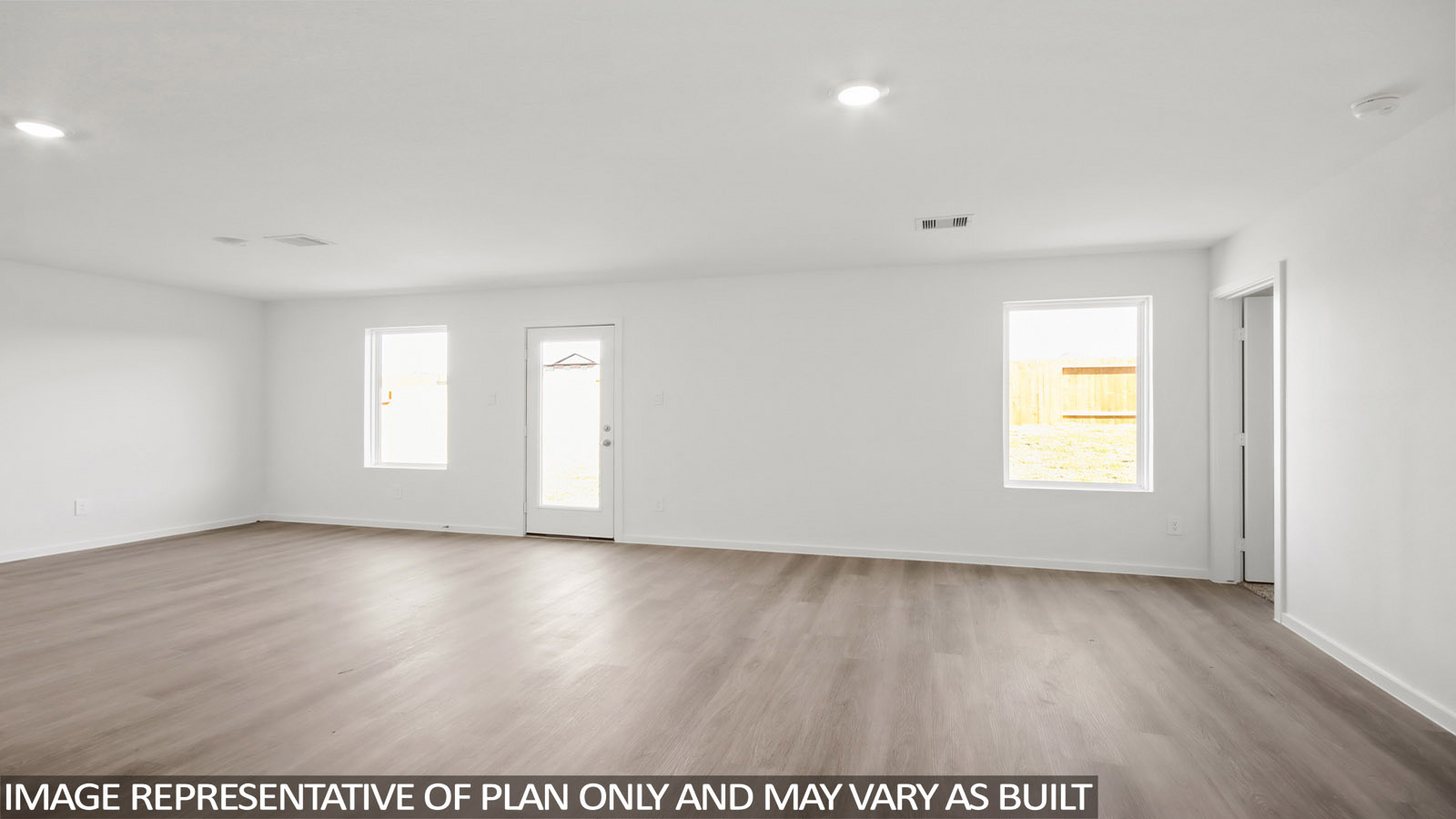 12205 Horseshoe Fld Bend Mustang Ridge, TX 78610 - Photo 7 of 20 a view of an empty room with wooden floor and a window