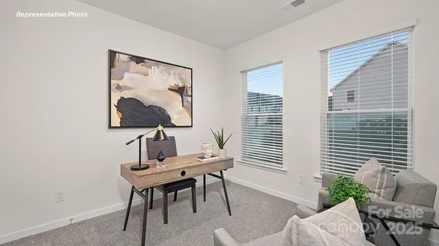 a view of a workspace with furniture