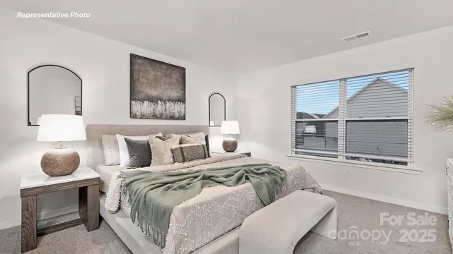 a bedroom with a bed and window