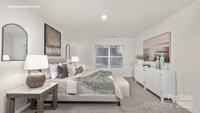 a bedroom with furniture and a window