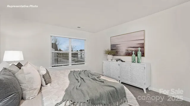 a bed room with a bed and a window