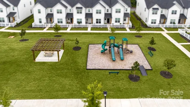 an aerial view of a house with swimming pool