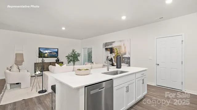 a view of living room with granite countertop furniture and floor to ceiling window