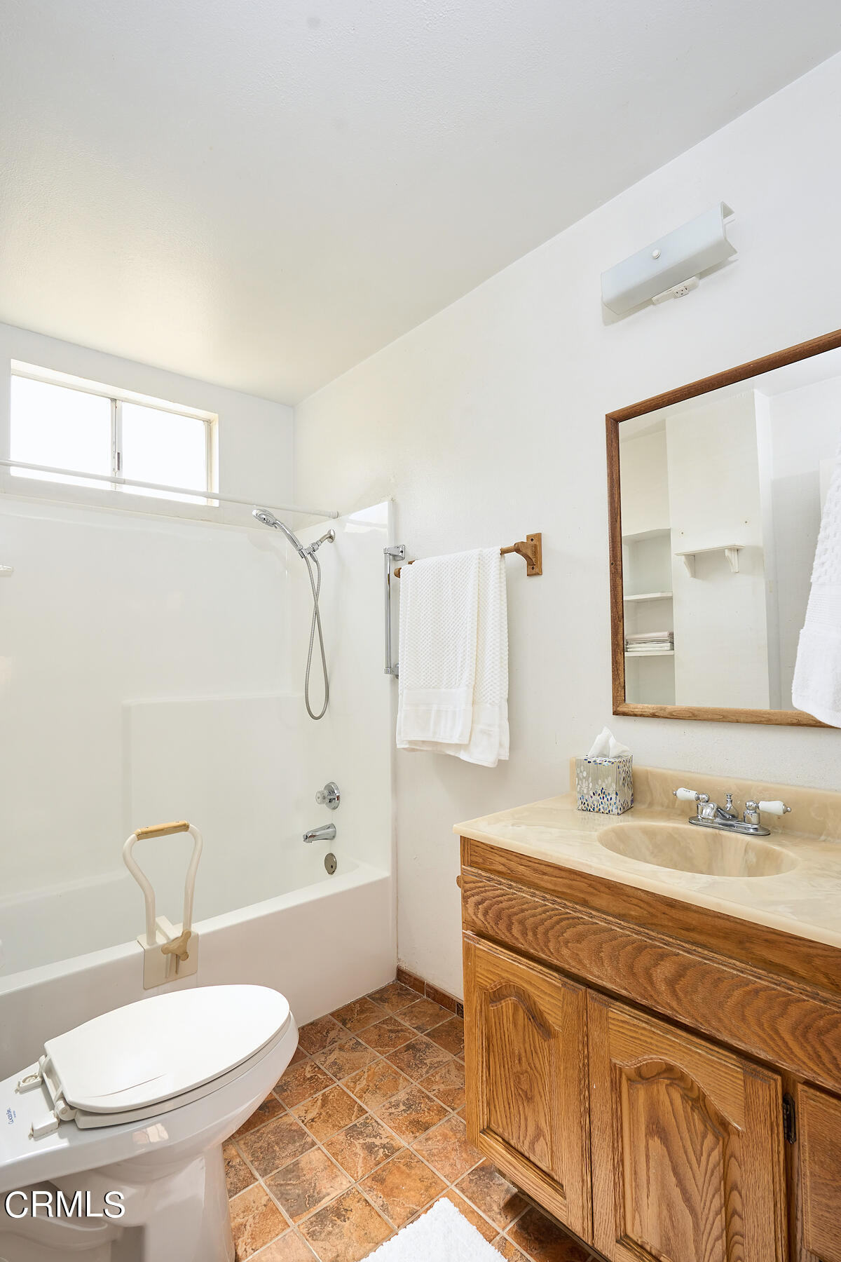 515 De Anza Way Oxnard, CA 93033 - Photo 16 of 48 a bathroom with a granite countertop sink a toilet a mirror and shower