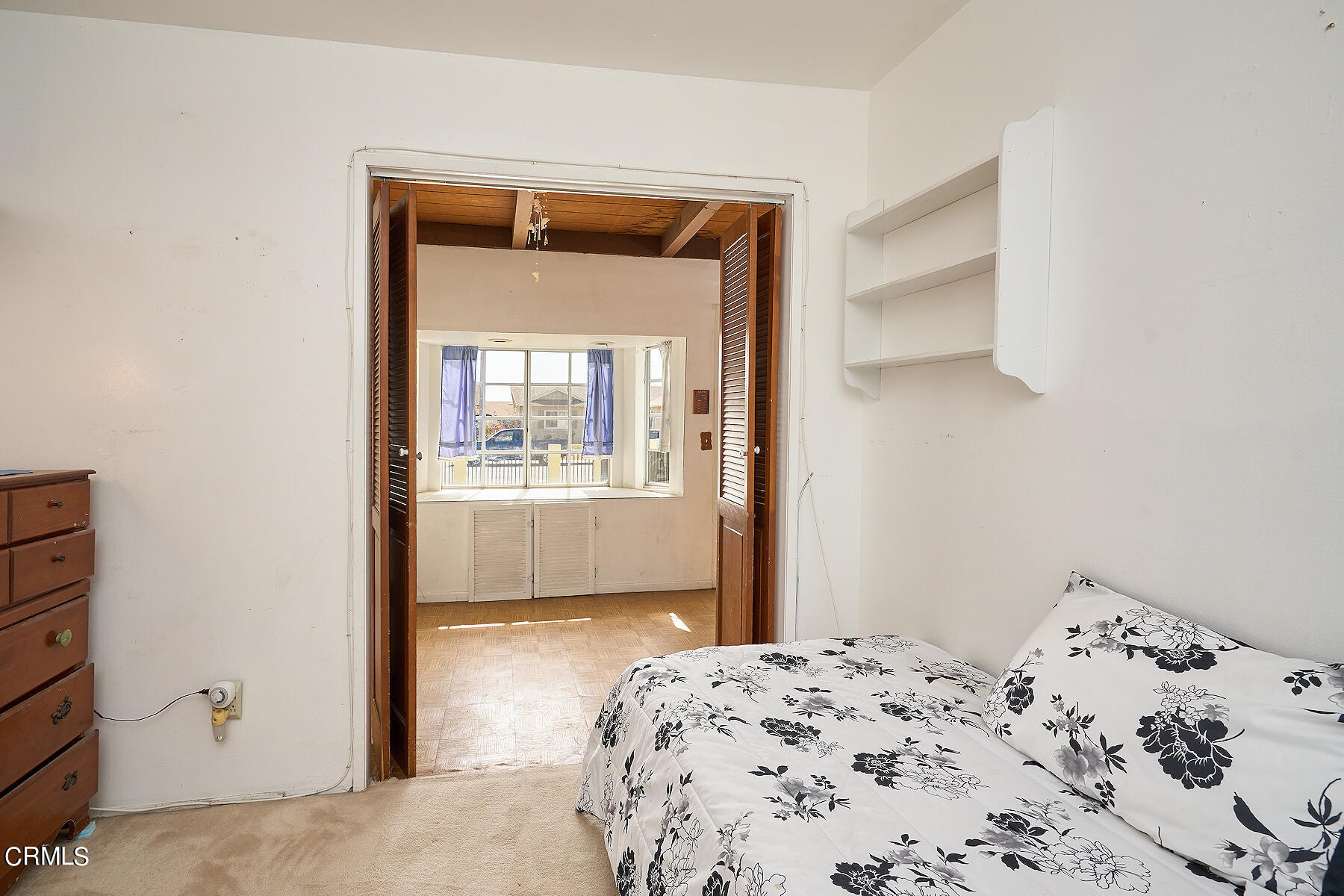 515 De Anza Way Oxnard, CA 93033 - Photo 17 of 48 a bedroom with a bed and utility room in it