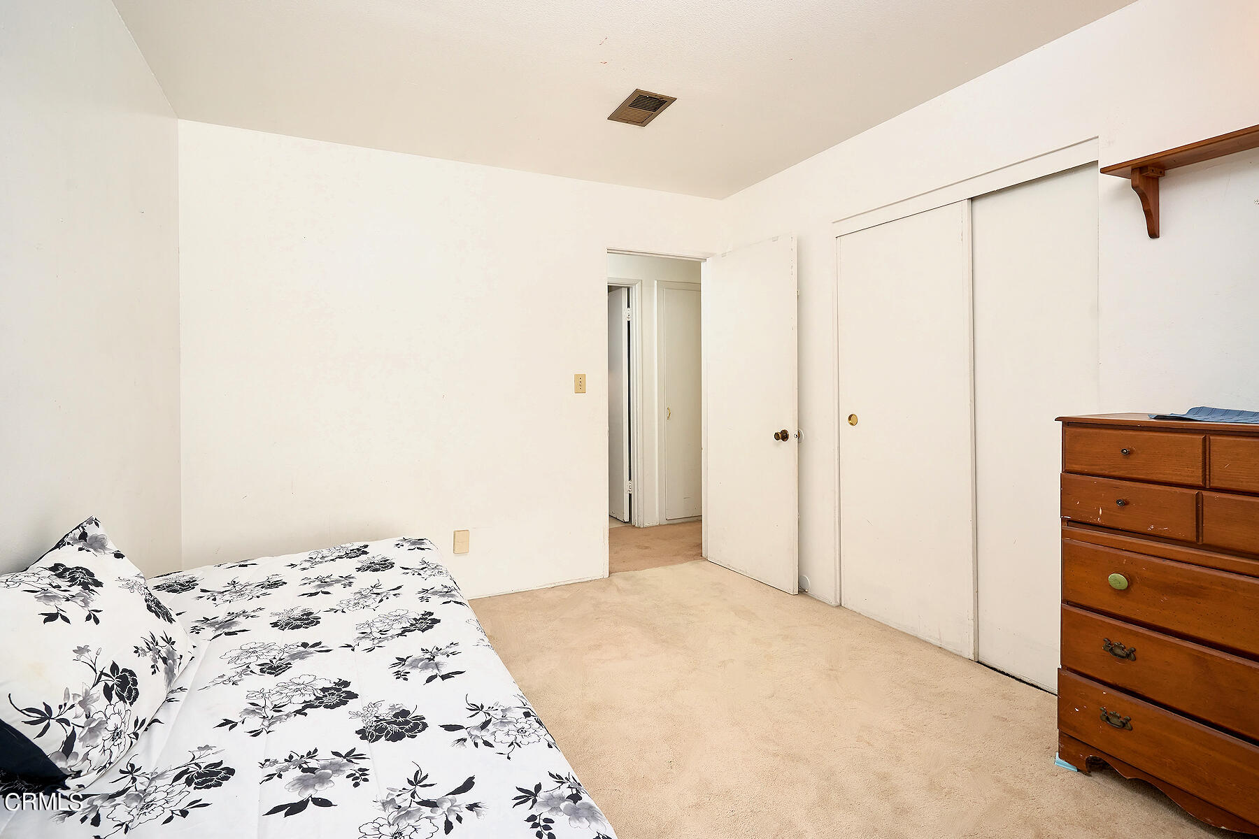 515 De Anza Way Oxnard, CA 93033 - Photo 18 of 48 a bedroom with a bed and a dresser