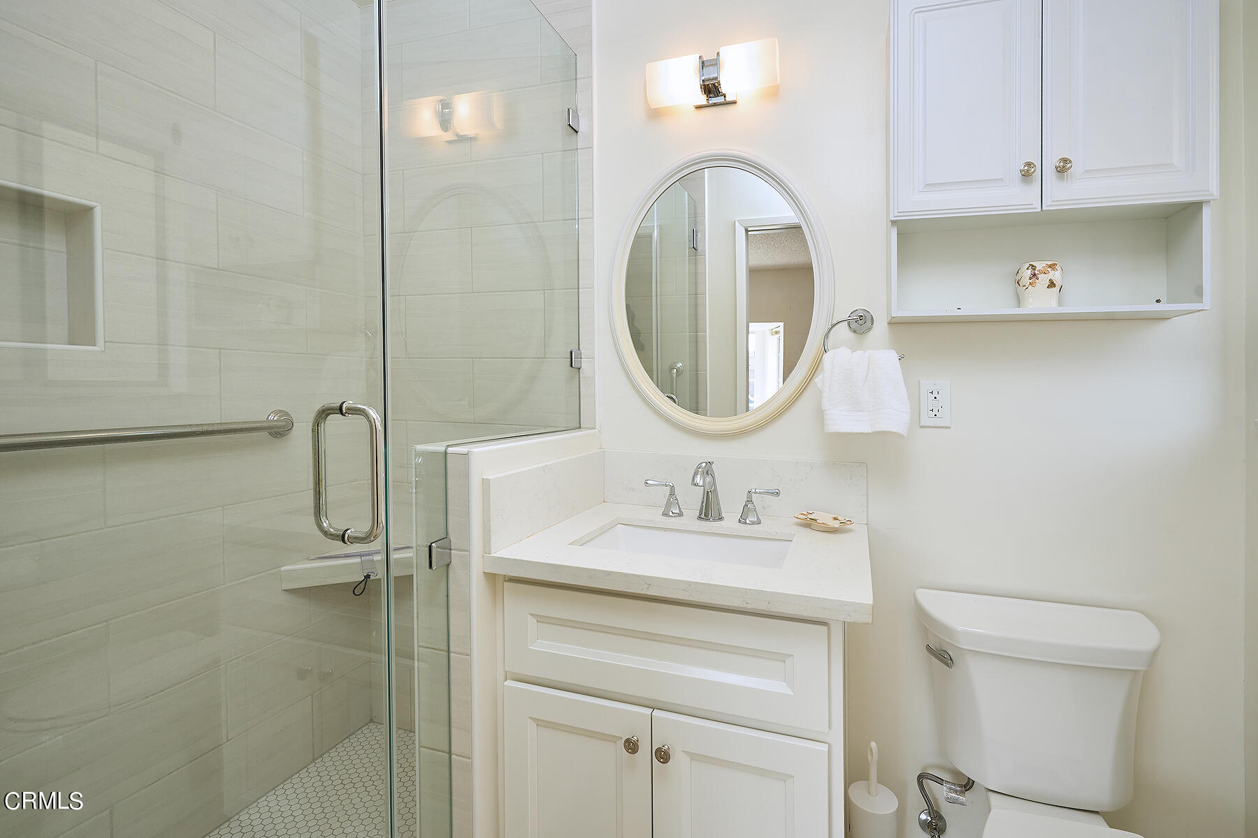 515 De Anza Way Oxnard, CA 93033 - Photo 25 of 48 a bathroom with a sink a toilet and a mirror