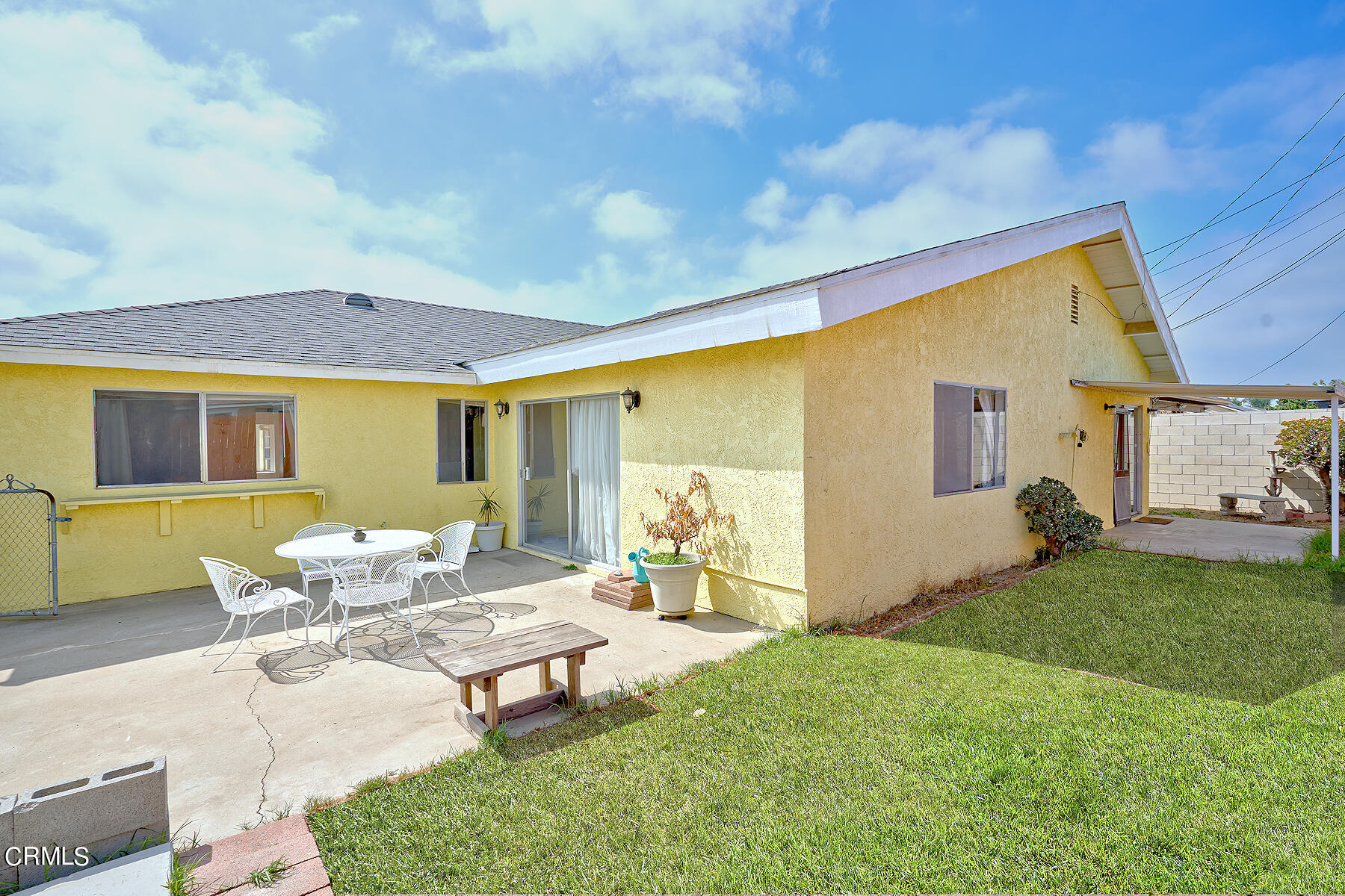 515 De Anza Way Oxnard, CA 93033 - Photo 31 of 48 a backyard of a house with table and chairs