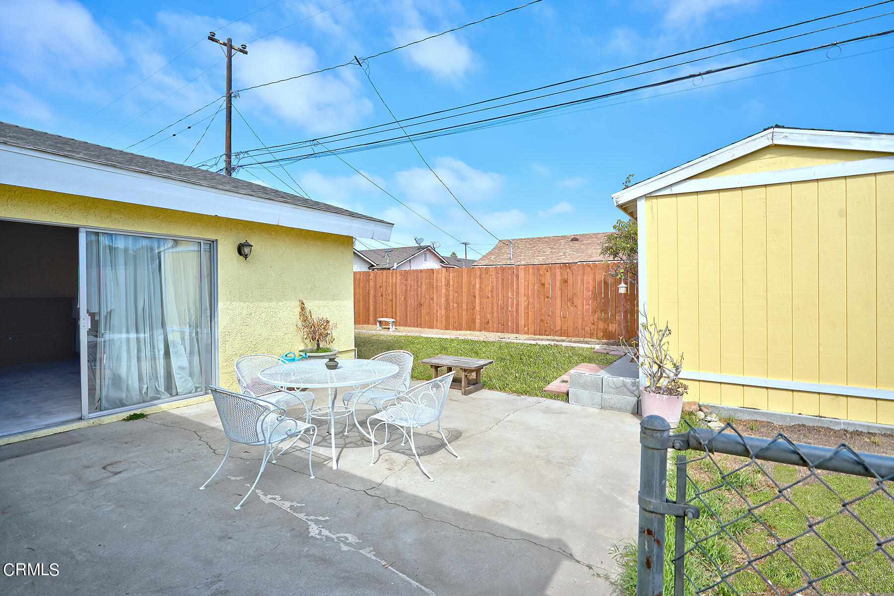 515 De Anza Way Oxnard, CA 93033 - Photo 37 of 48 a patio with a glass top table and chairs