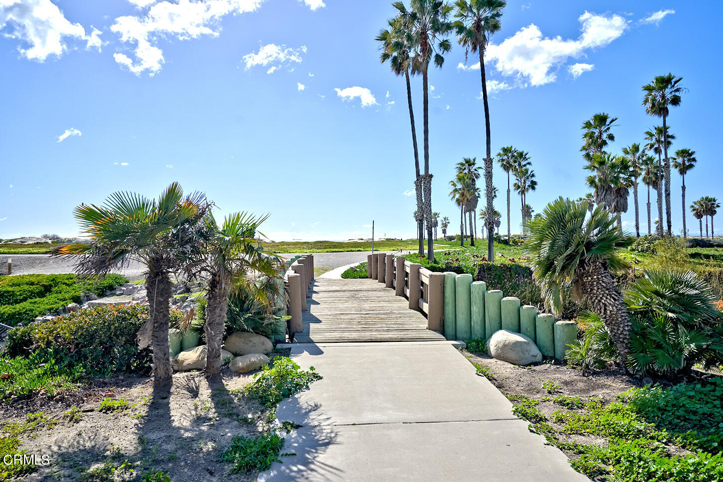 515 De Anza Way Oxnard, CA 93033 - Photo 40 of 48 a view of a pathway with a fountain in front of a house