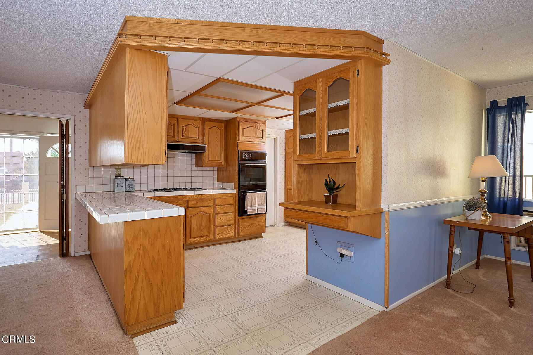 515 De Anza Way Oxnard, CA 93033 - Photo 8 of 48 a kitchen with a stove and a refrigerator