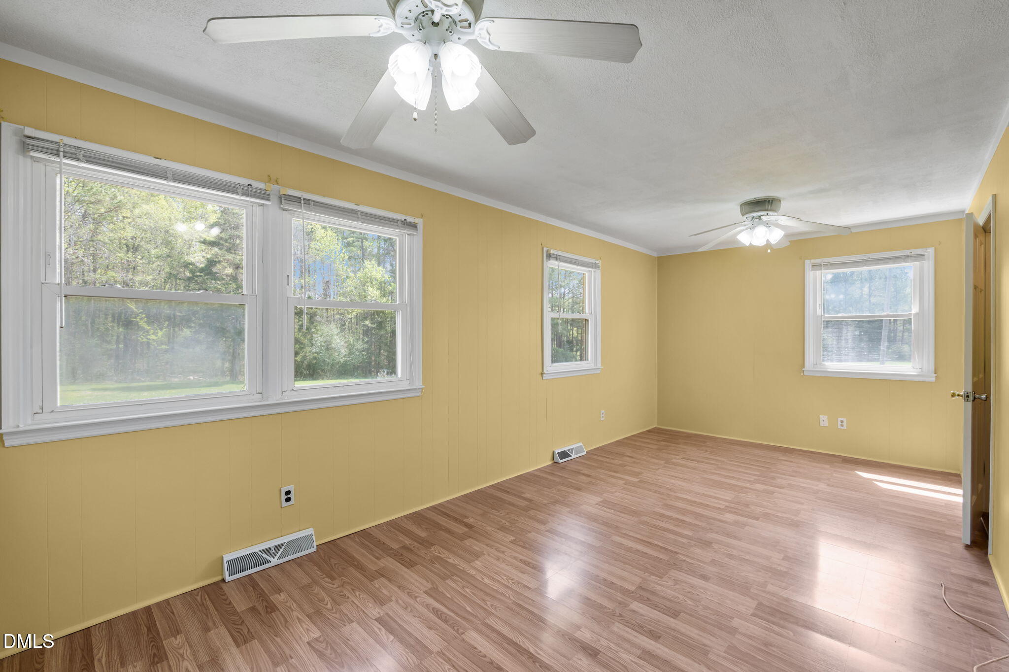95 Harold Gill Road Roxboro, NC 27574 - Photo 18 of 53 a view of empty room with wooden floor and fan
