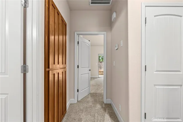 a view of a bathroom from the hallway