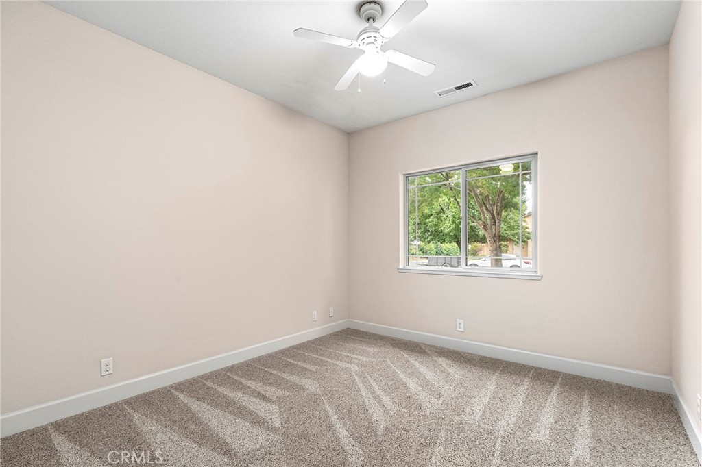 3 Sunflower Court Chico, CA 95926 - Photo 25 of 40 an empty room with a window and a fan
