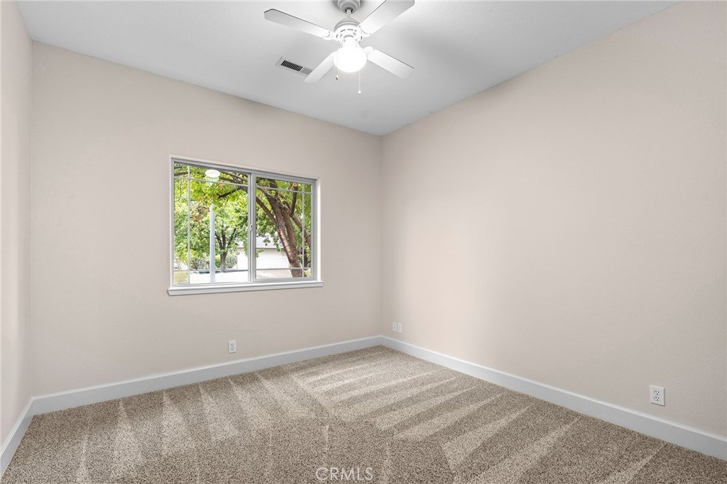3 Sunflower Court Chico, CA 95926 - Photo 27 of 40 an empty room with a window and a fan