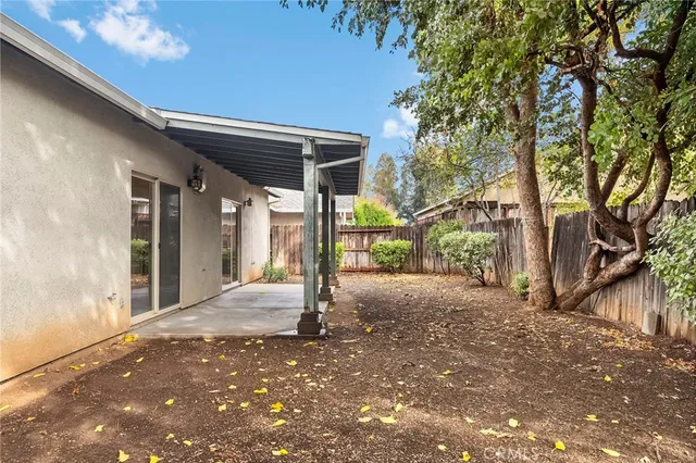 a view of a house with a tree