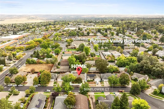 an aerial view of residential building with green space